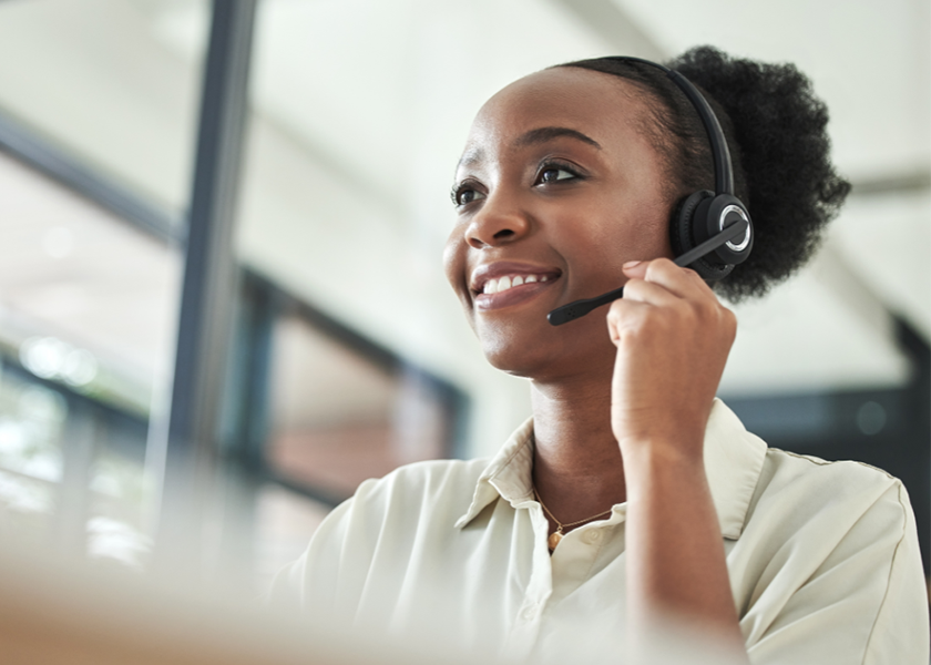 Lady at reception desk on phone 