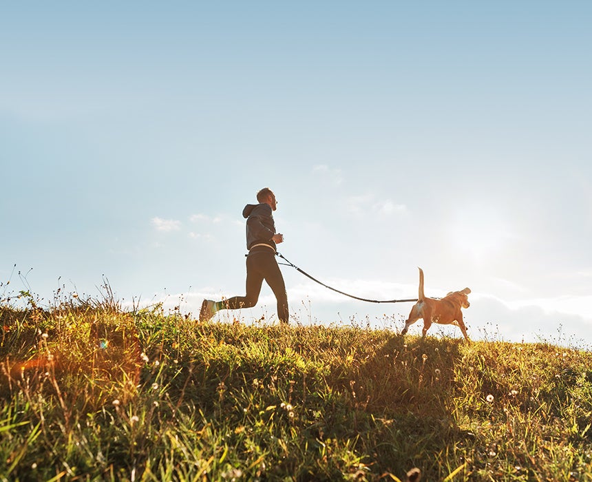 Man running with dog