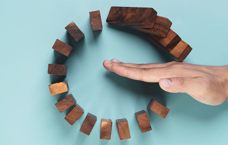 person managing domino pieces