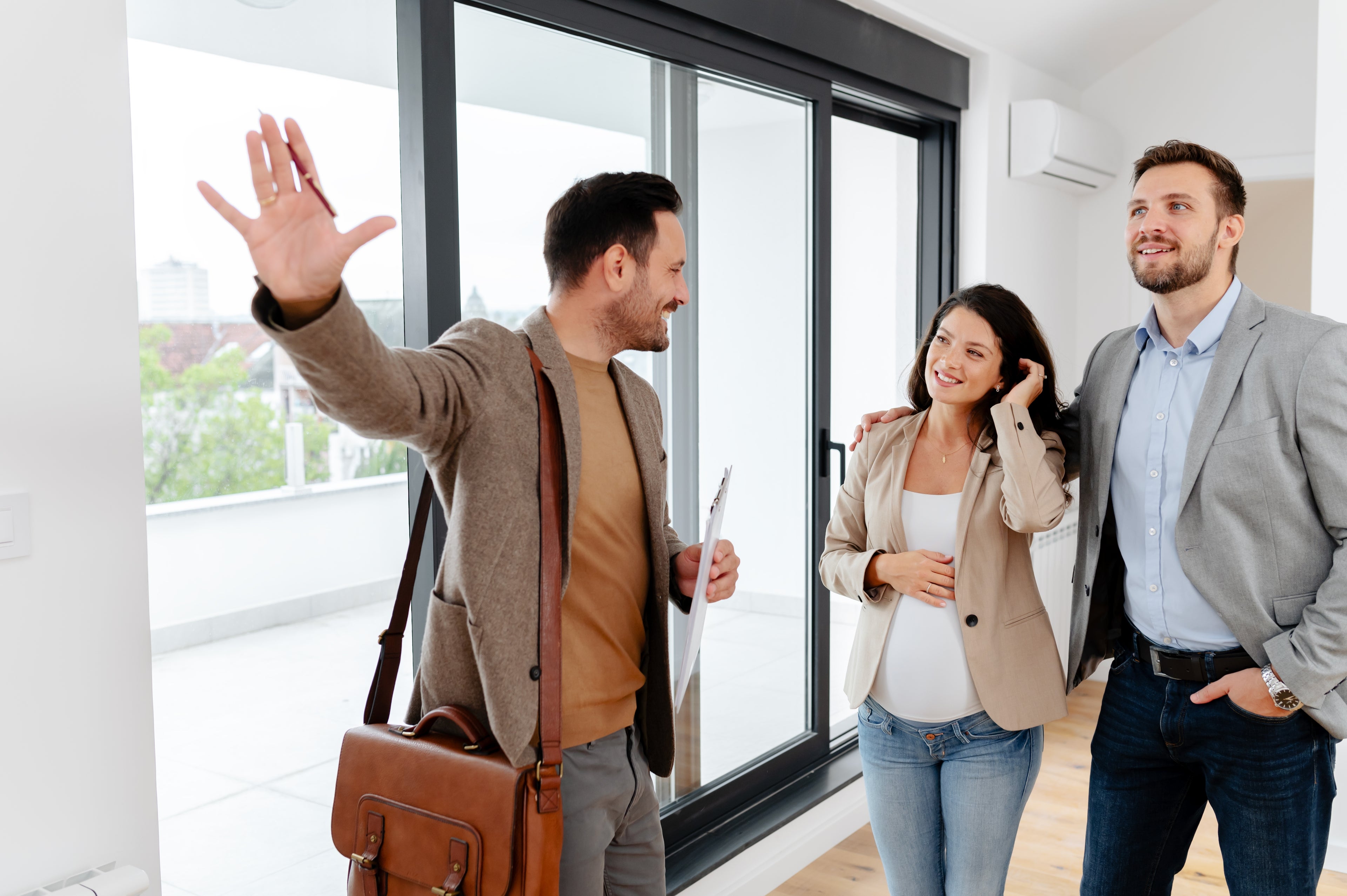 A dentist and their partner at an open home after enquiring about mortgages for dentists and home loans for dentists.