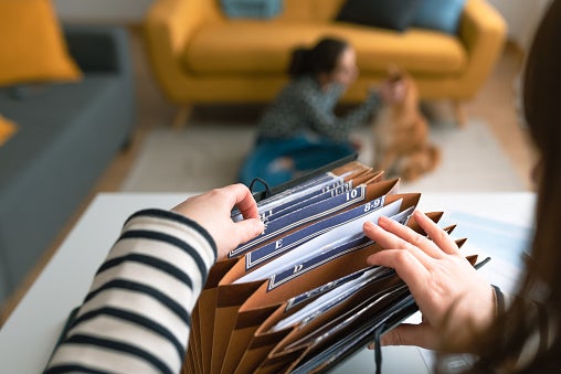 woman searching through folder