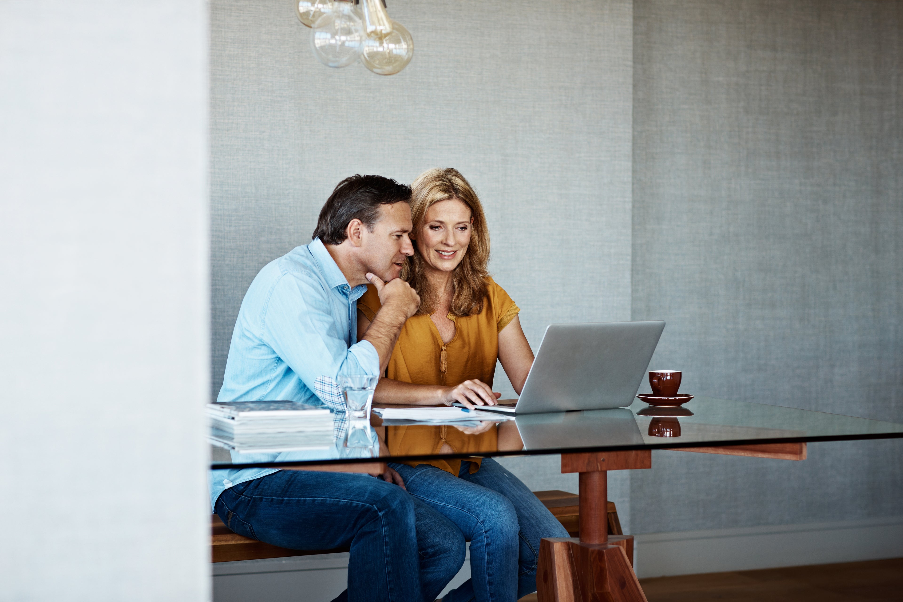 Married couple looking at laptop