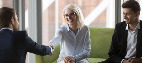 woman shaking a mans hand