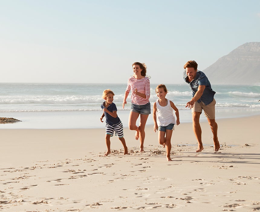 Running on beach with family