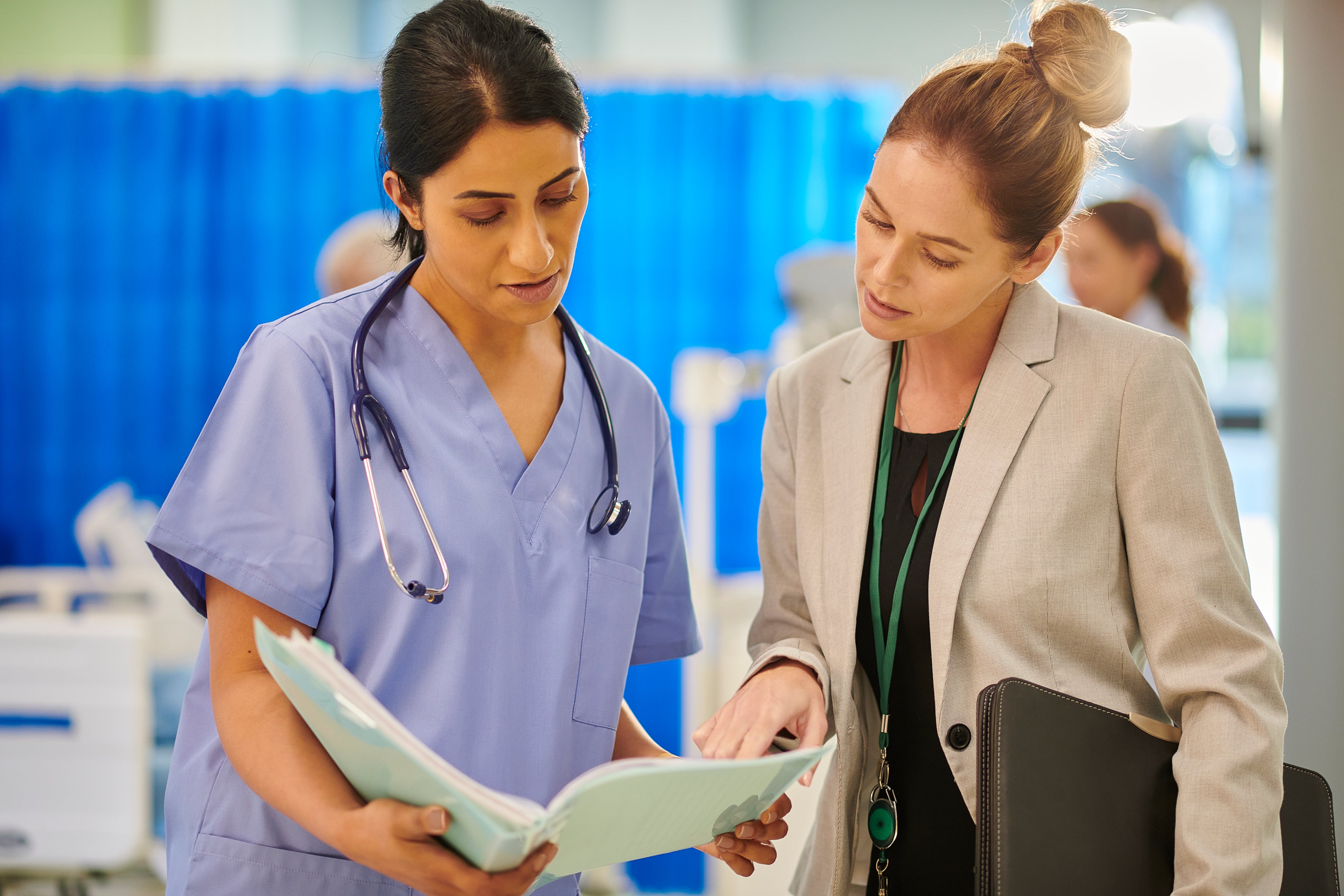 doctor talking to nurse